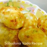 Close-up of golden-brown, crispy Sabudana Vada (sago fritters) in a bowl, showcasing their texture and ingredients like sago pearls and peanuts. The text "Sabudana Vada Recipe" is overlaid on the image.